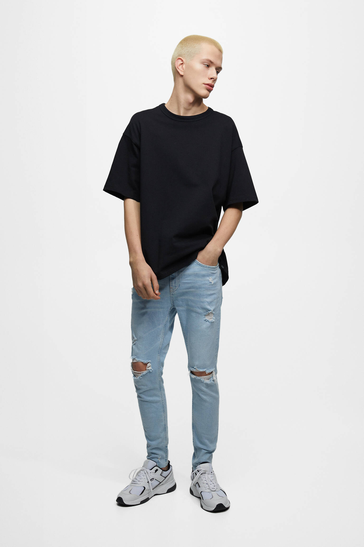 Calça jeans skinny com detalhes rasgados - azul claro