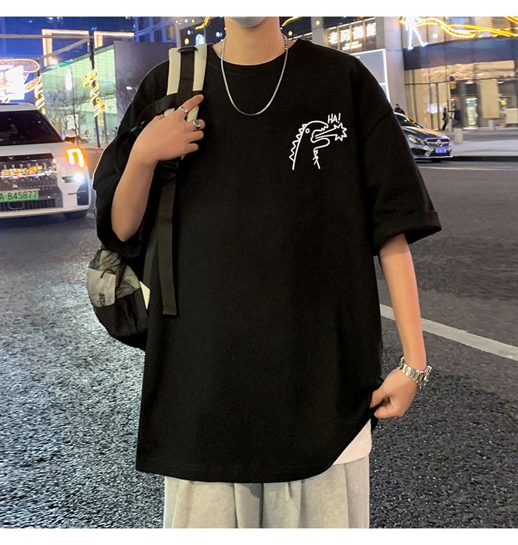 Wolfkane - Oversized T-shirt met korte mouwen, ronde hals en dinosaurusprint