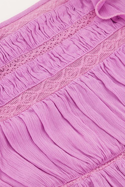 Paarse top met lange mouwen met tapes en ruffles