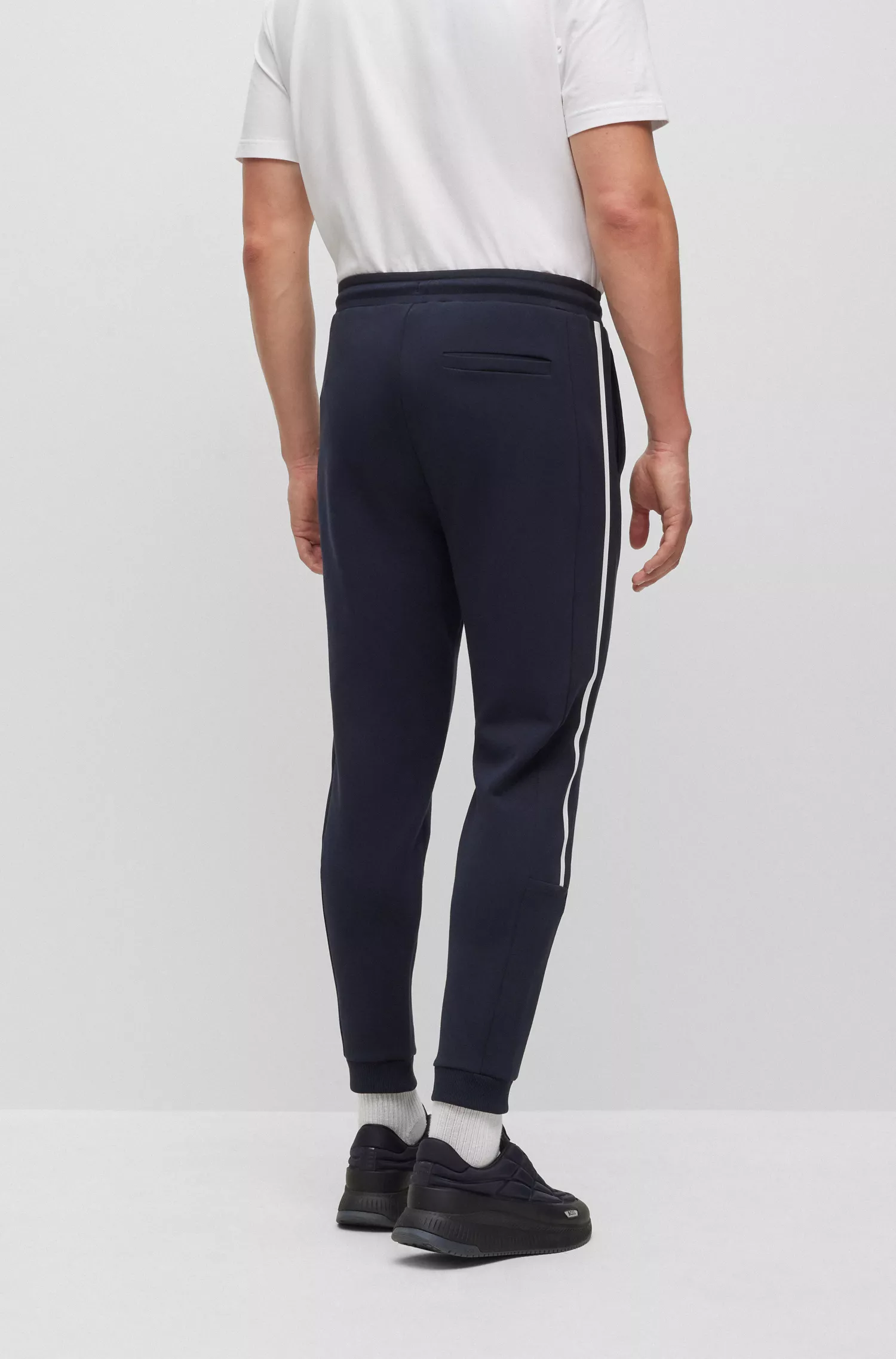 Calça de fato de treino BOSS em mistura de algodão verde com estampas de riscas e logótipo.
