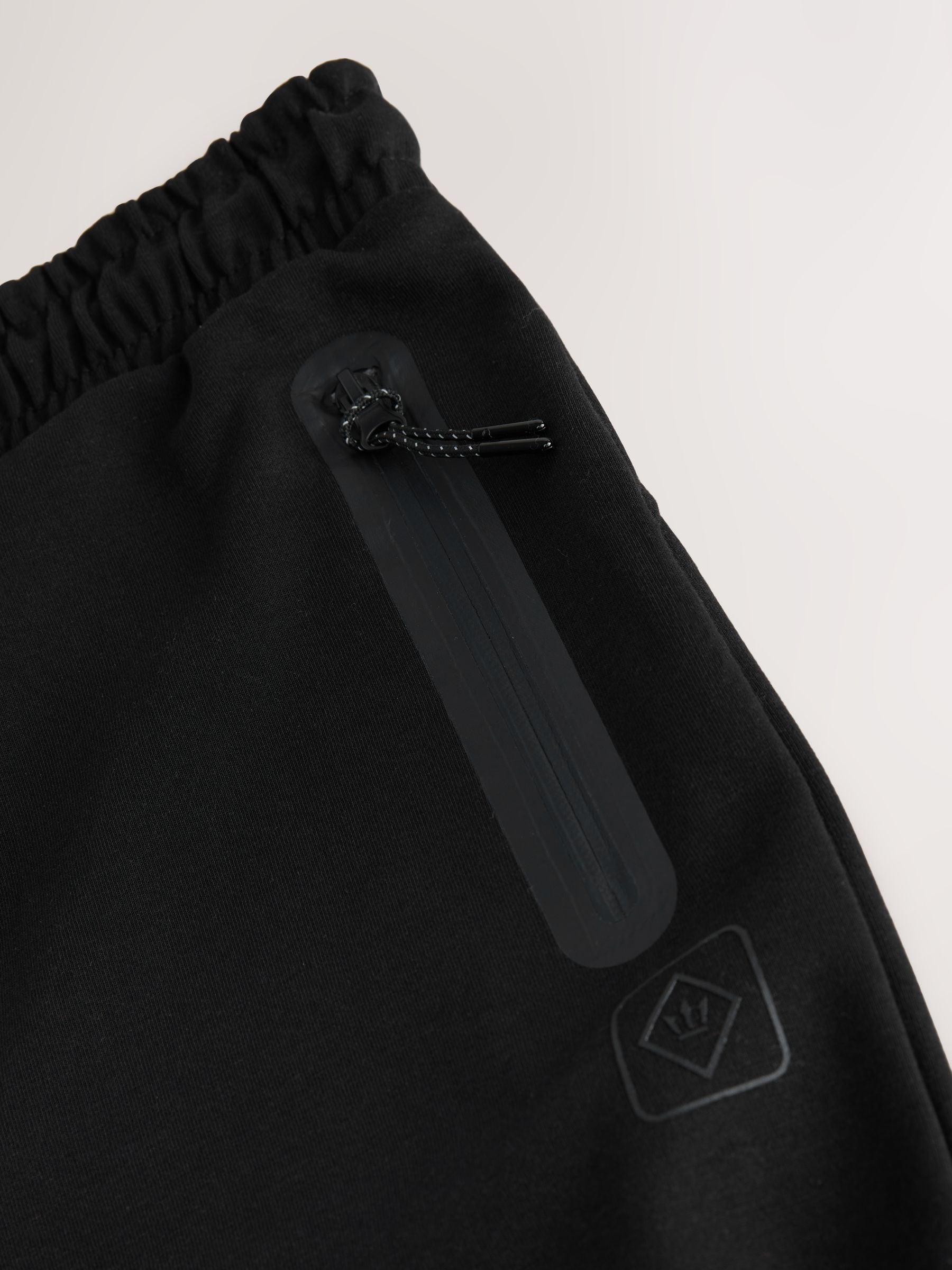Zwart - Sport- en vrijetijdsjoggingbroek met boorden