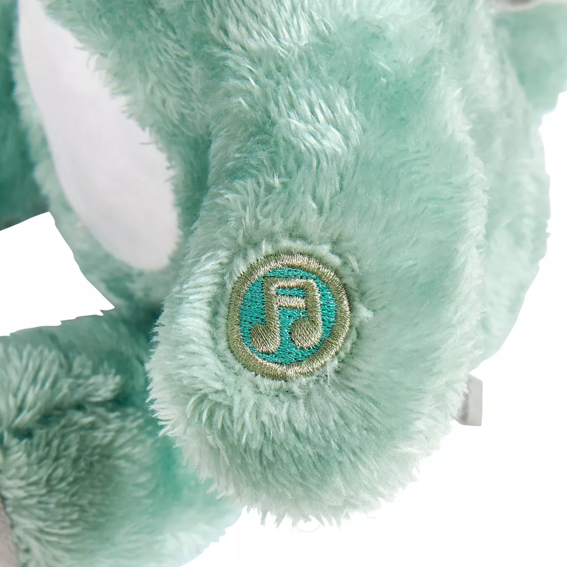 Peluche veilleuse et musicale bébé Dino Verte