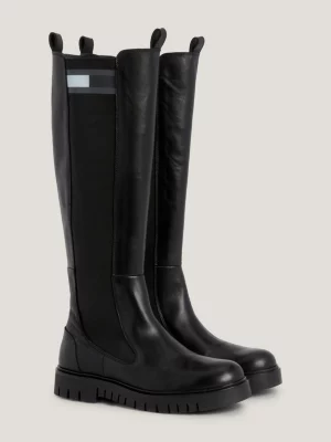 Botas de cano alto em couro com detalhes em fita