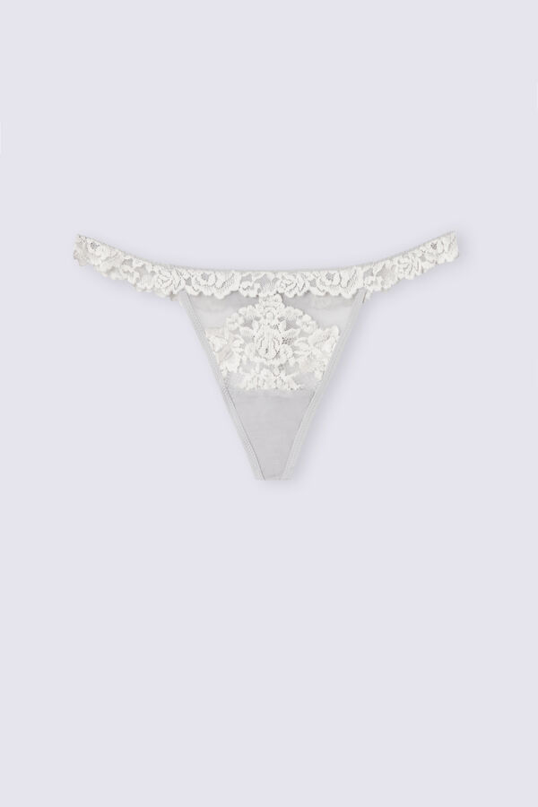 Calcinha fio dental com tira lateral e estampa floral delicada