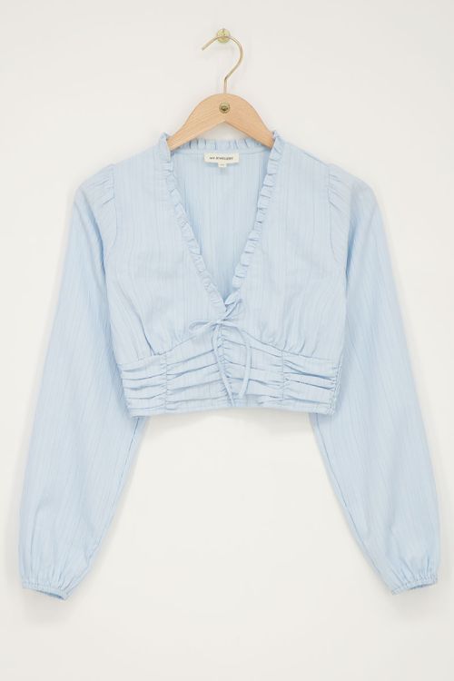 Lichtblauwe crop top met ruffles en smock