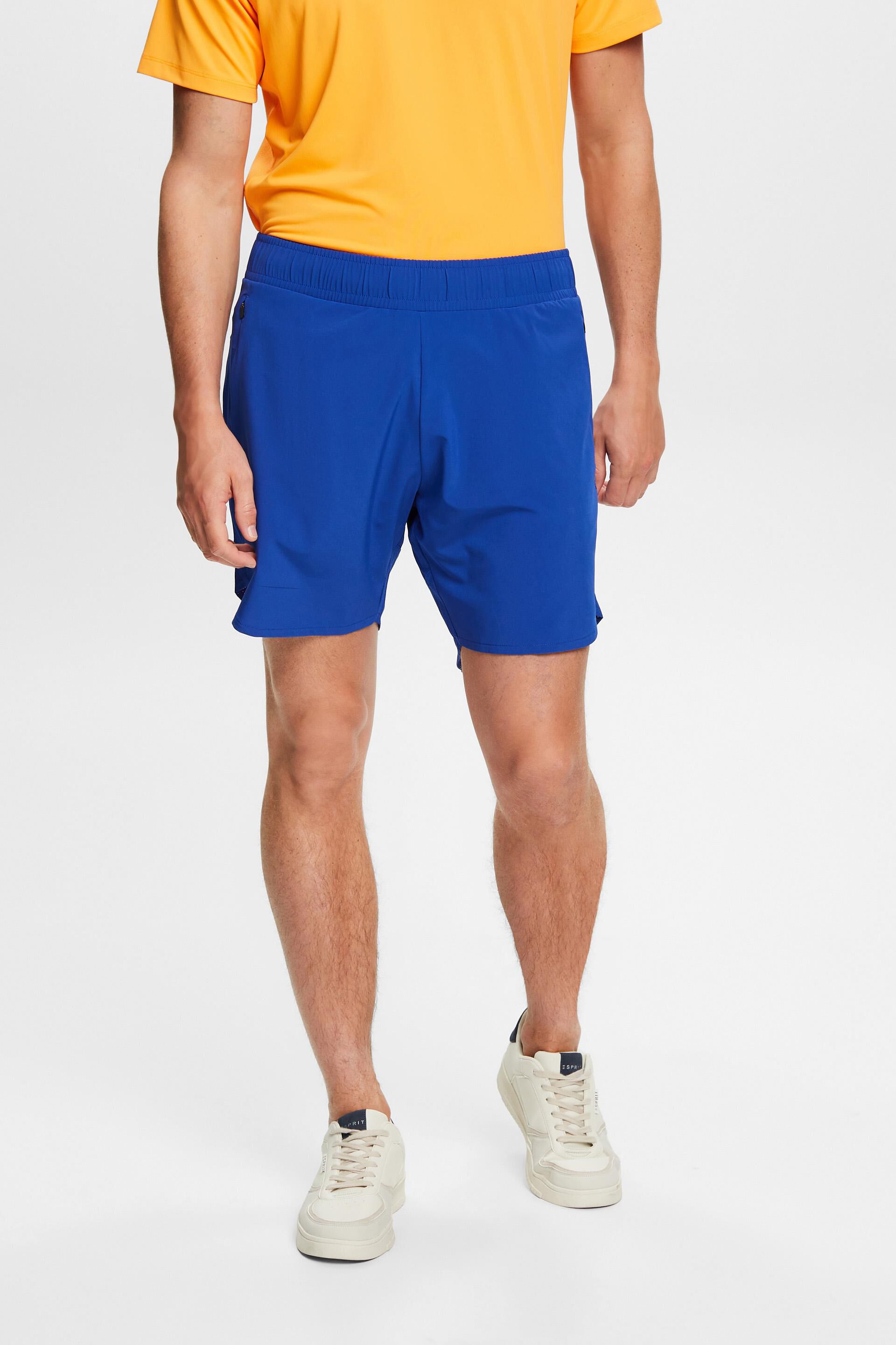 Short de sport à poches zippées