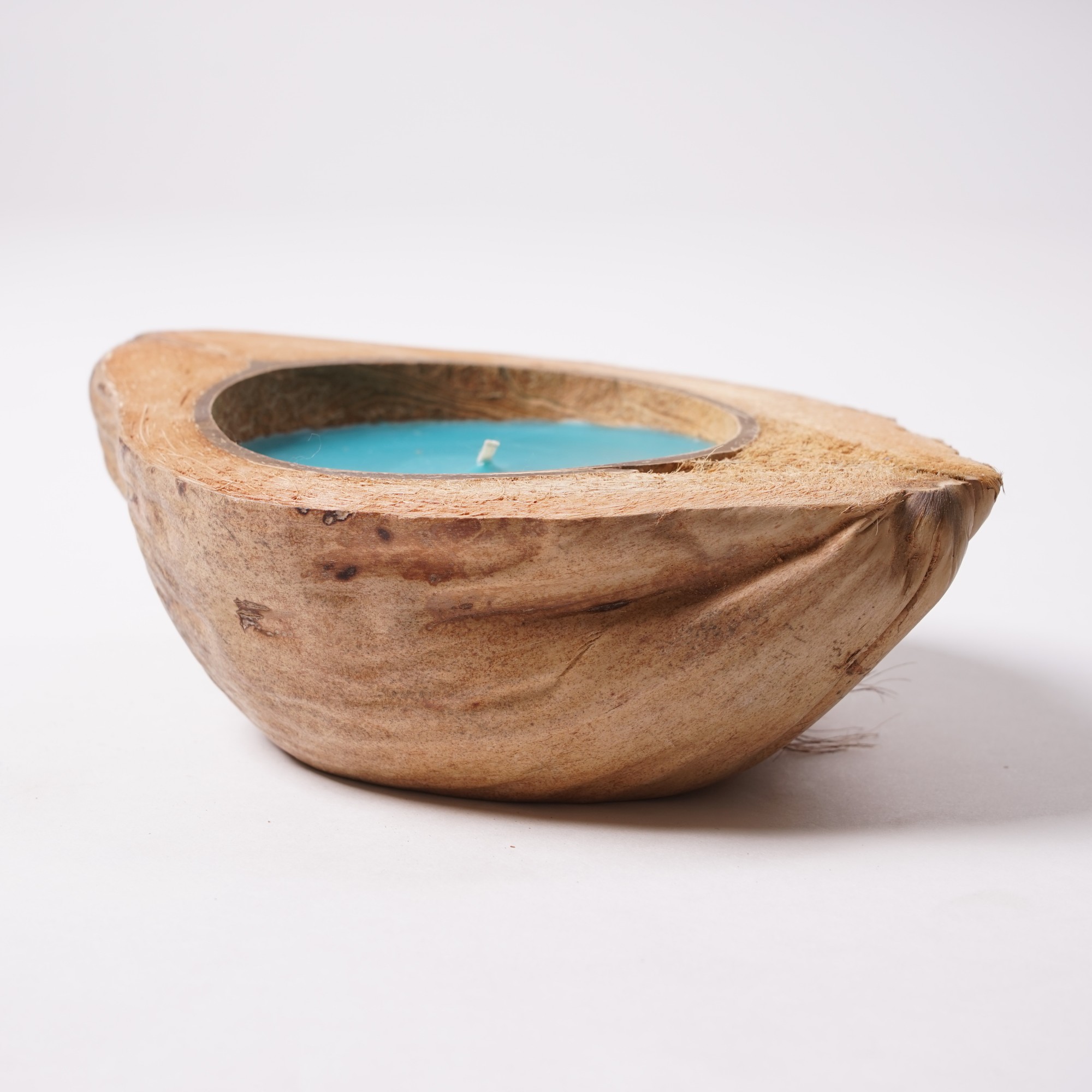 Duftkerze 'Island Spices', in Kokosnusshälfte, braun, blau, Ø 13-17 cm von fischer's lagerhaus