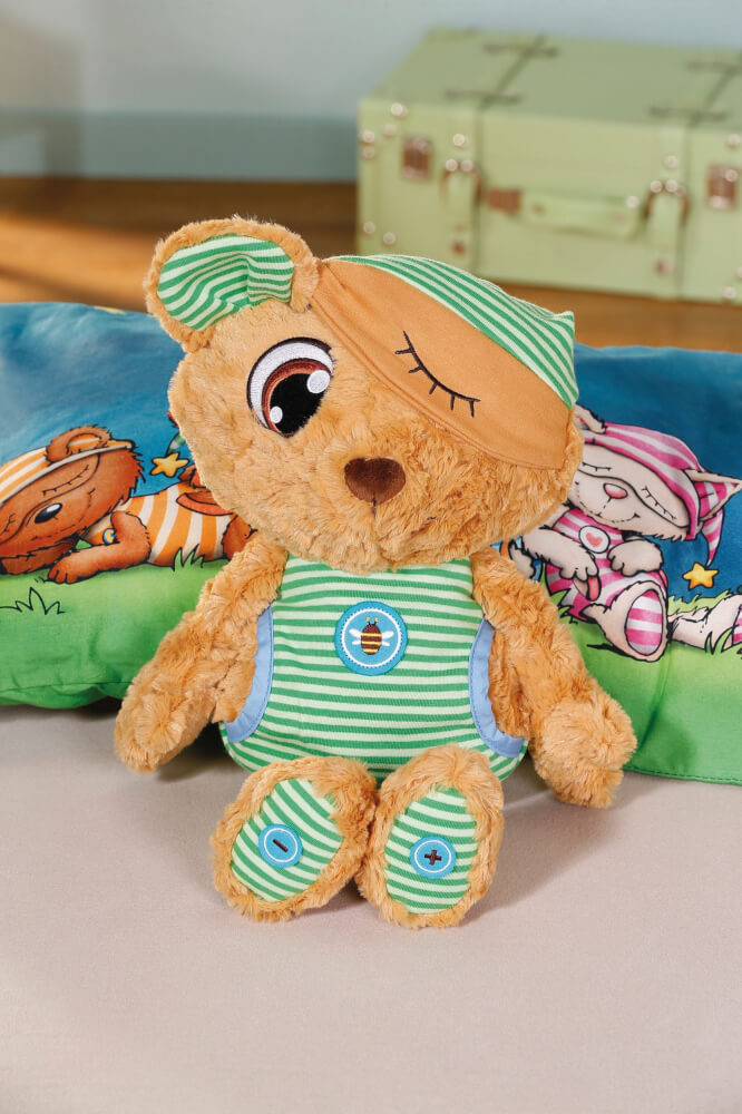 NICI Schlafmützen Schlummsi Schlummergeschichten-Bär in grünem Pyjama