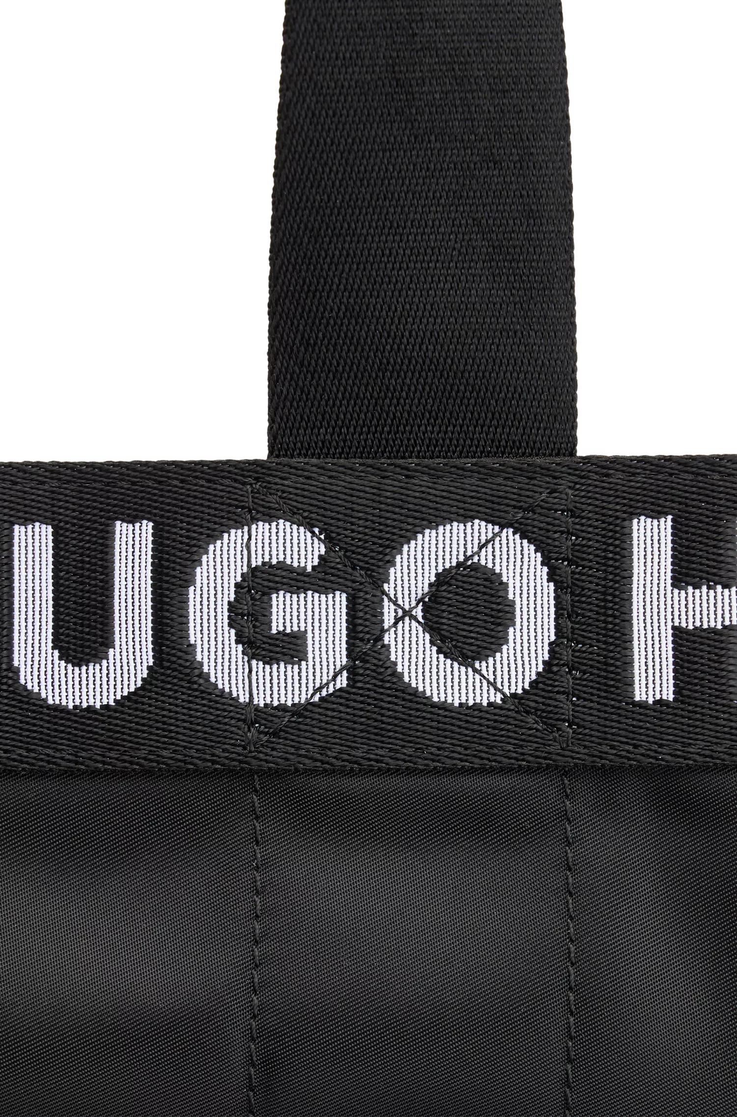 Bolsa tote vermelha HUGO com detalhes de logotipo contrastantes repetidos.