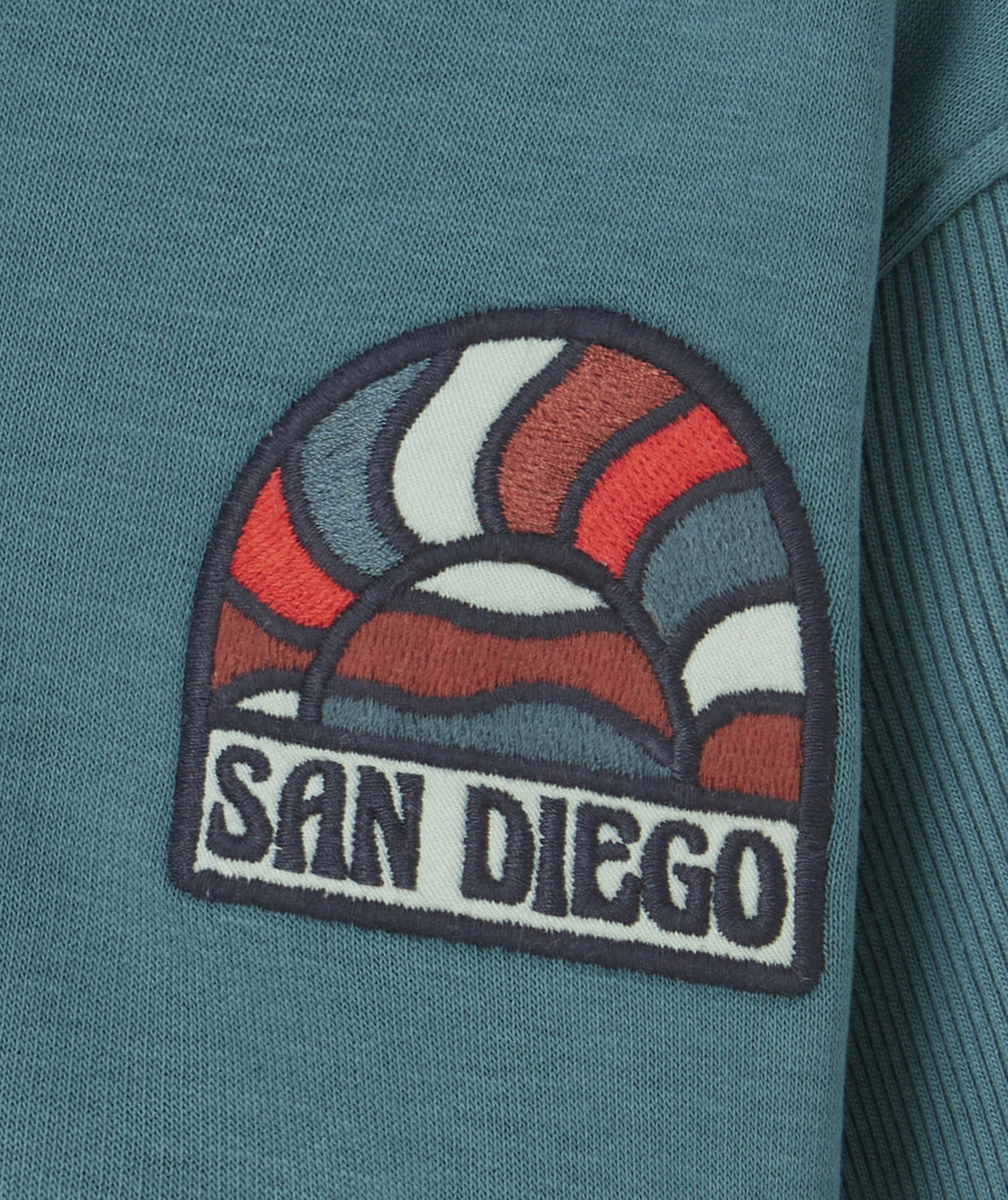 GILET À CAPUCHE GARÇON EN COTON BIO VERT AVEC PATCH BRODÉ SAN DIEGO