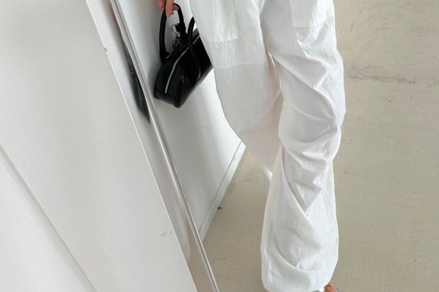 Coris - Spaghettibandjes, effen jumpsuit met open rug en strikbandjes