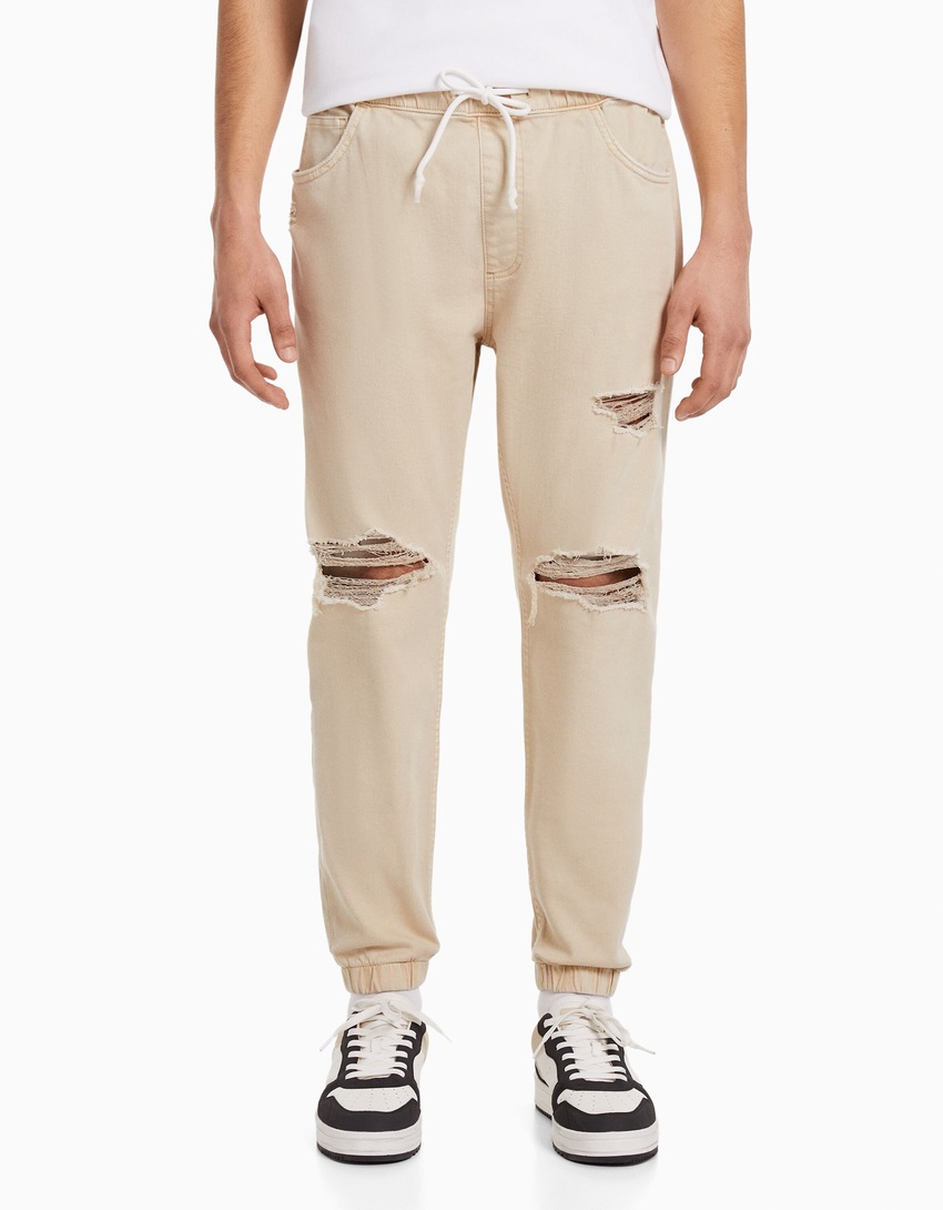 calça jogger rasgada