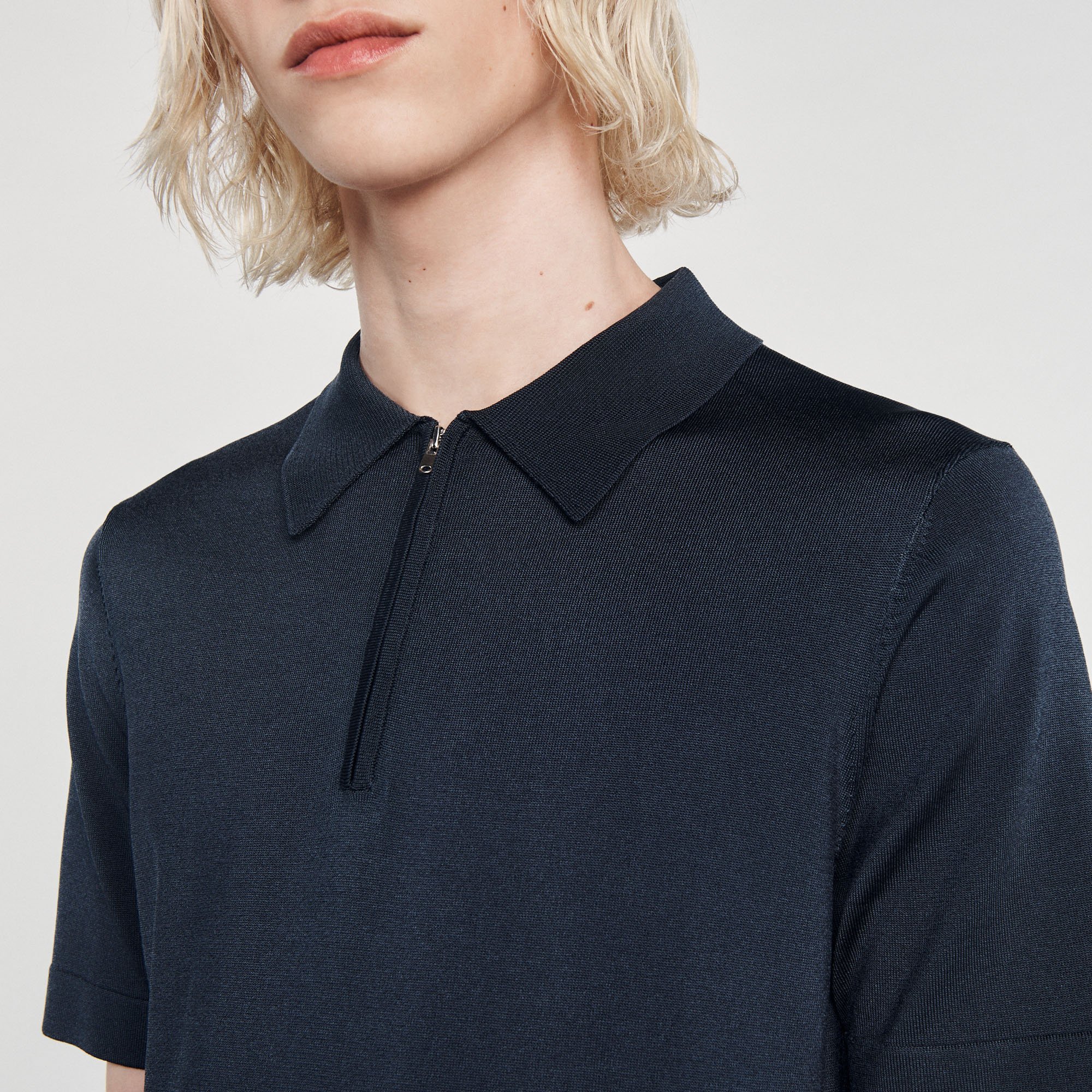 Polo en maille á col zippe