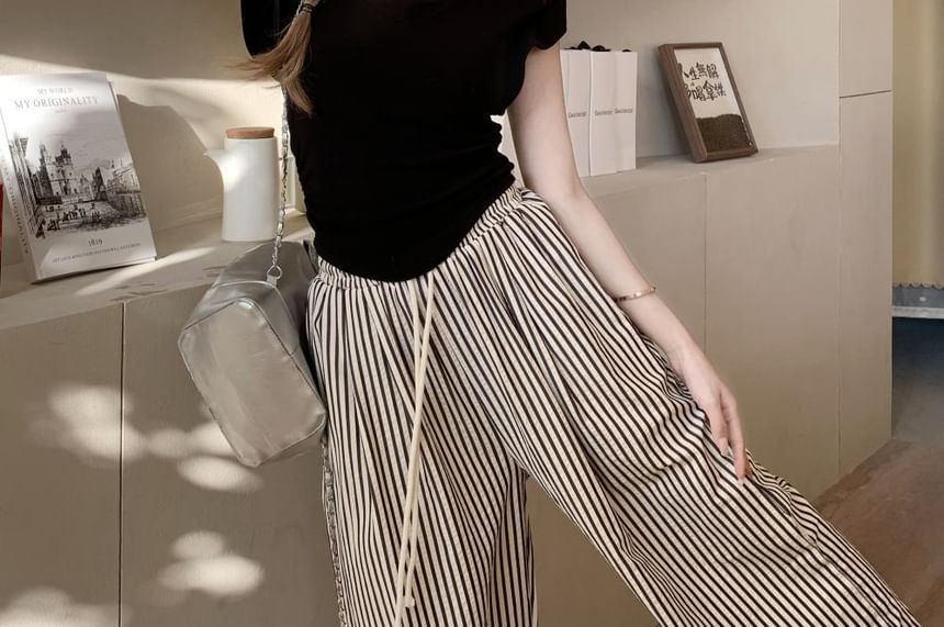 Moon City - Gestreepte broek met hoge taille en wijde pijpen
