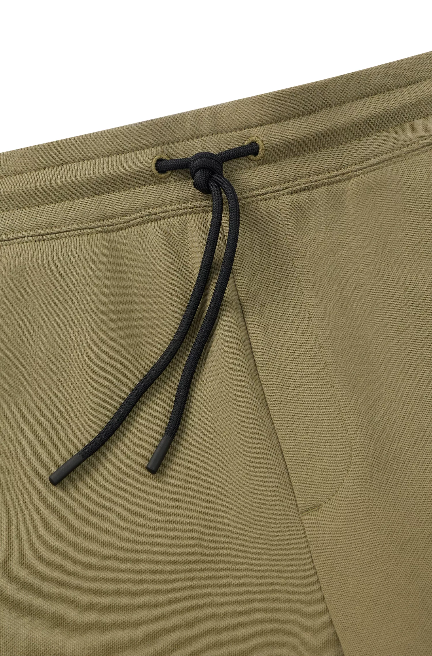 Calça de fato de treino HUGO vermelha em tecido atoalhado de algodão com bolsos cargo.
