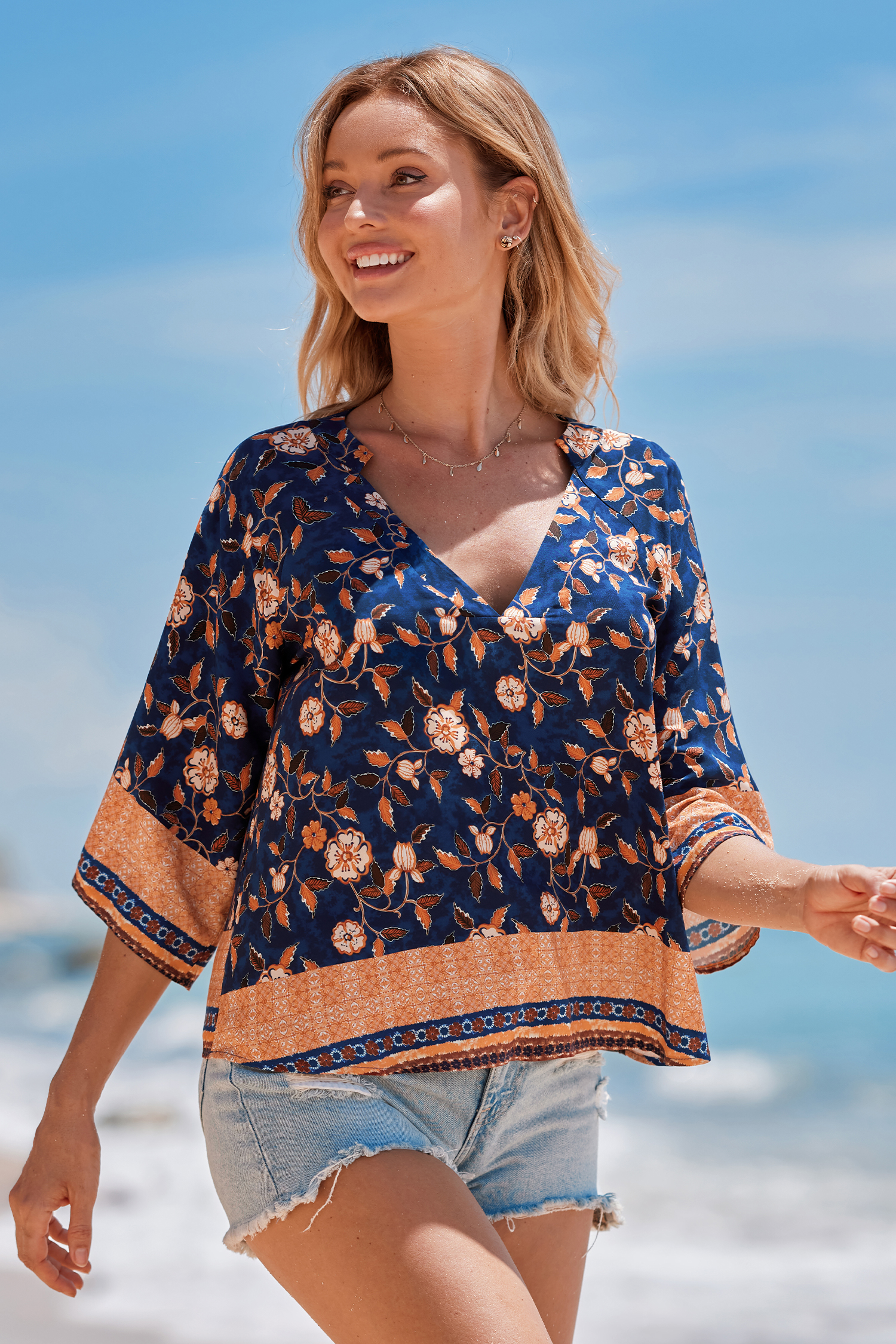 Haut blouson à fleurs bleu et orange