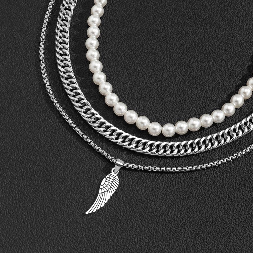Gretlyn - Set: Kunstparelketting + Ketting + Vleugelhangerketting