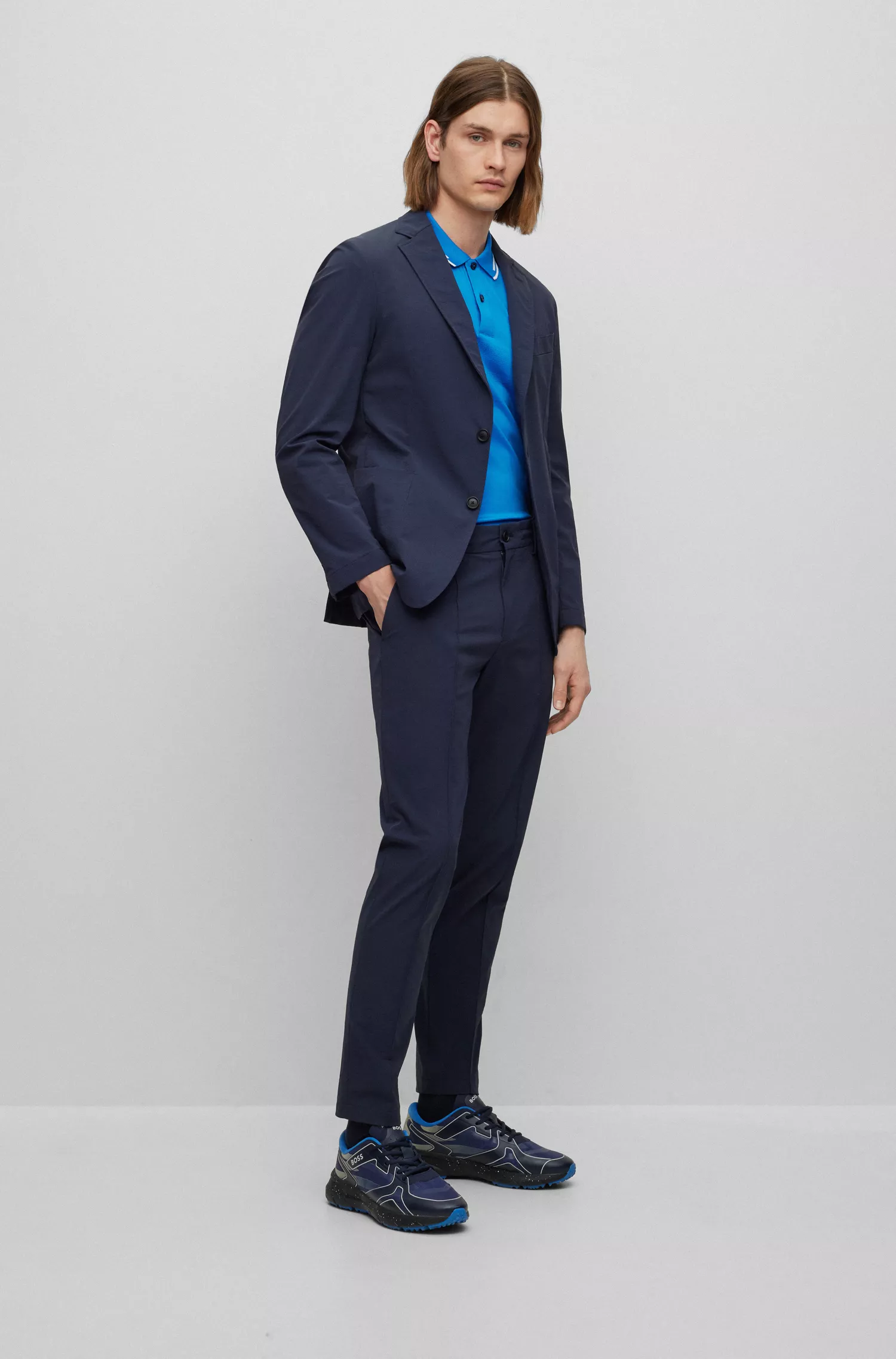 Camisa polo BOSS preta de algodão interlock com corte slim e listras jacquard.