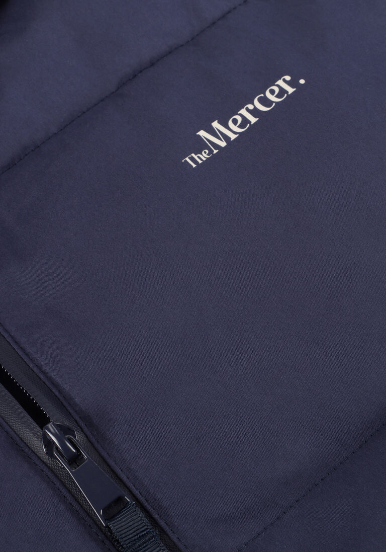 donkerblauwe mercer amsterdam gewatteerde jas the mercer puffer jacket