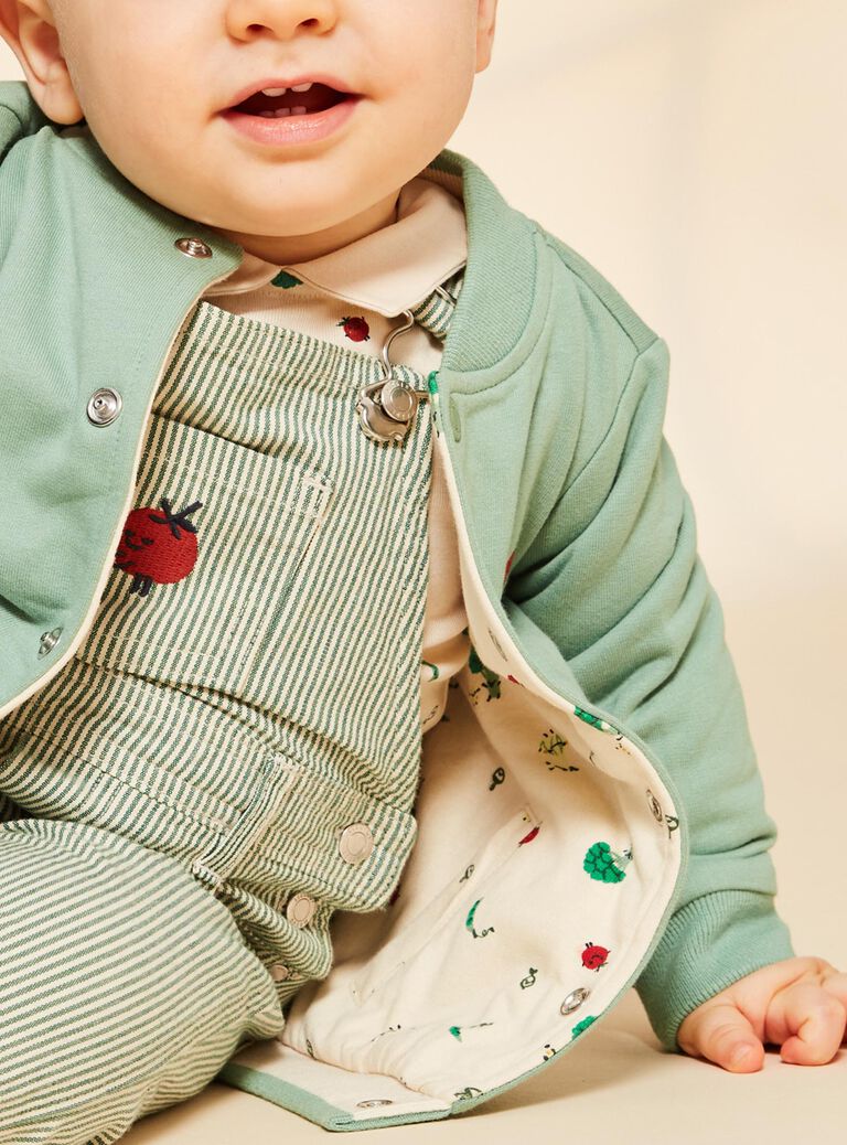 Gilet réversible vert et vanille en molleton style varsity