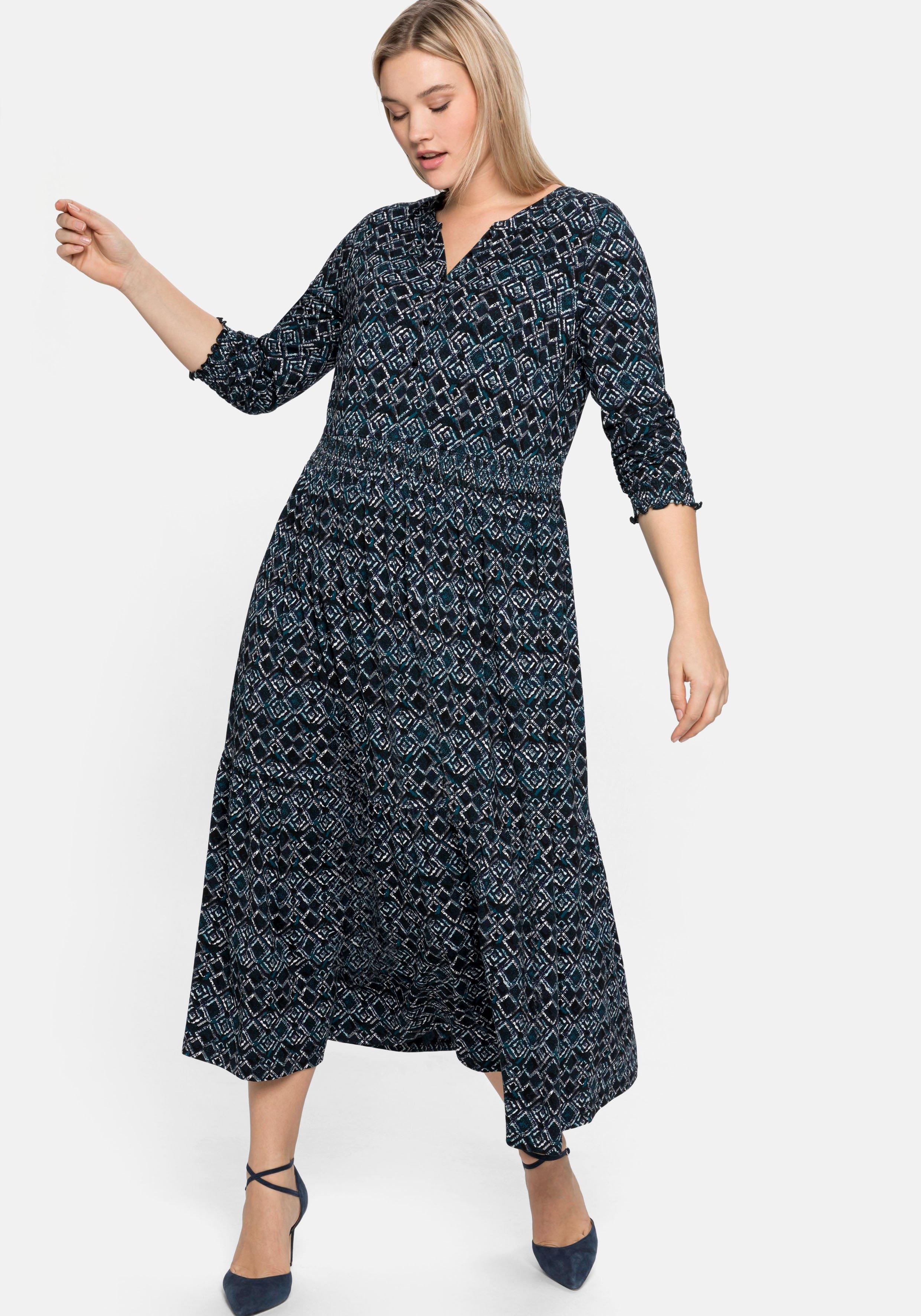 Jerseykleid mit Alloverdruck und Smokdetails