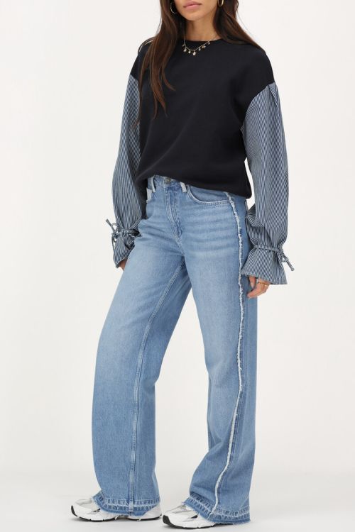 Lichtblauwe wide leg jeans met contrasterende zak