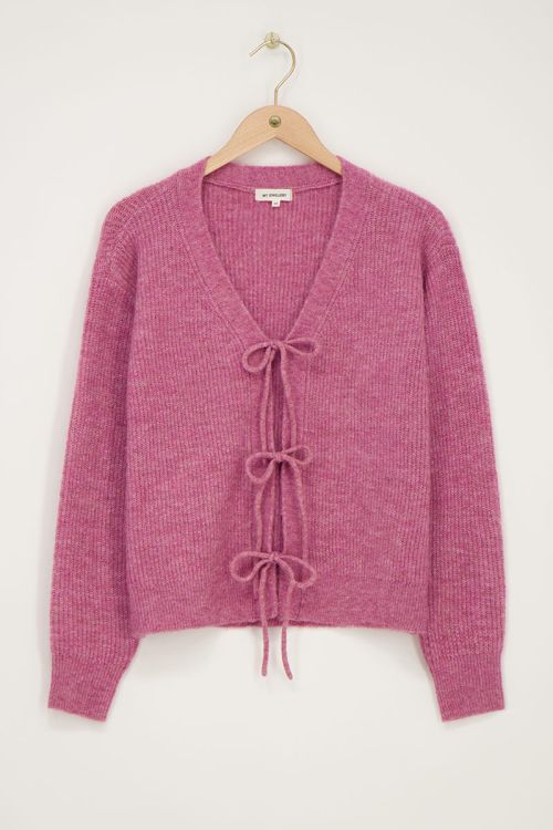 Roze vest met strikjes