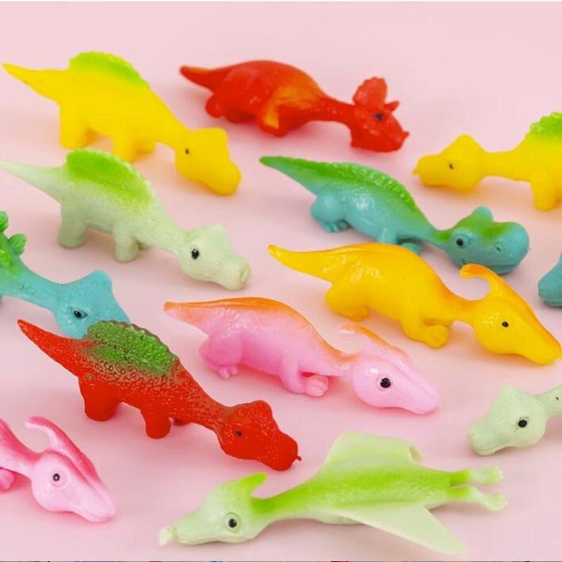 (9x3cm) Finger Stretch Schleuder Dino Flying Anti Stress Spielzeug Fliegender Katapult Dinosaurier - Assortiert