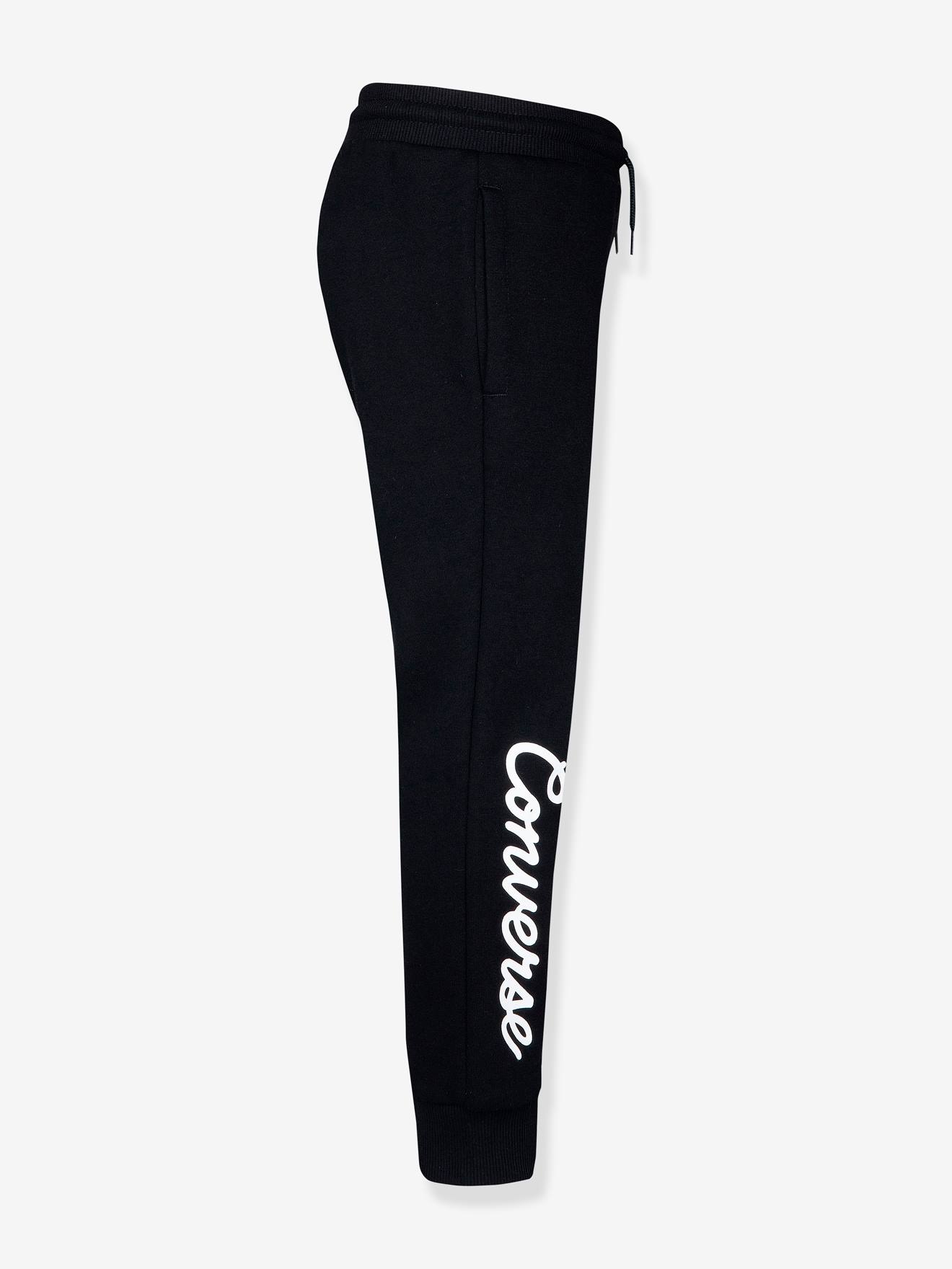 Calça de fato de treino infantil preta da marca Converse com patch Chuck.
