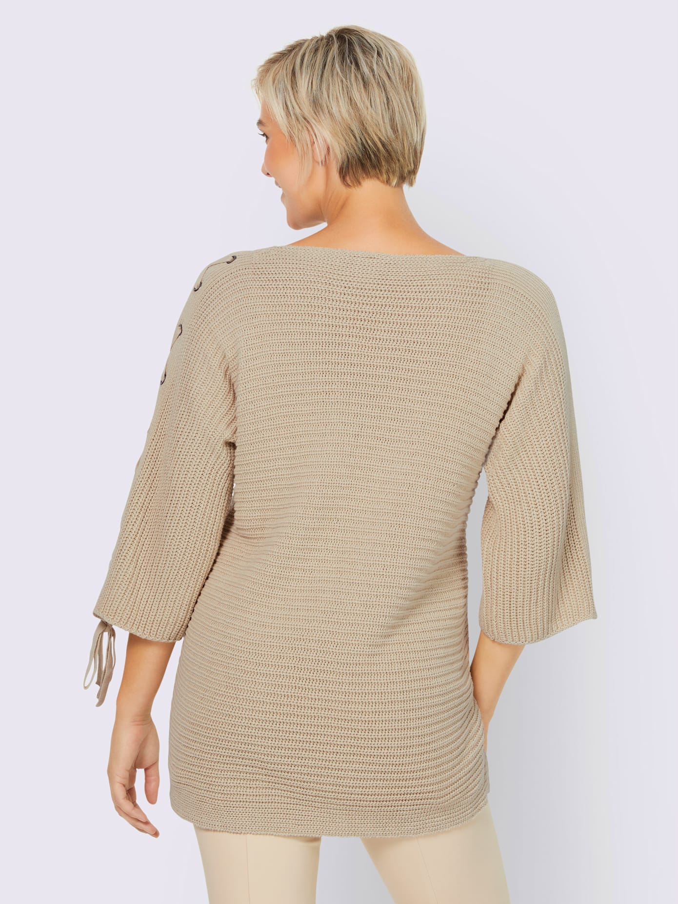 Pull laçage mode aux manches