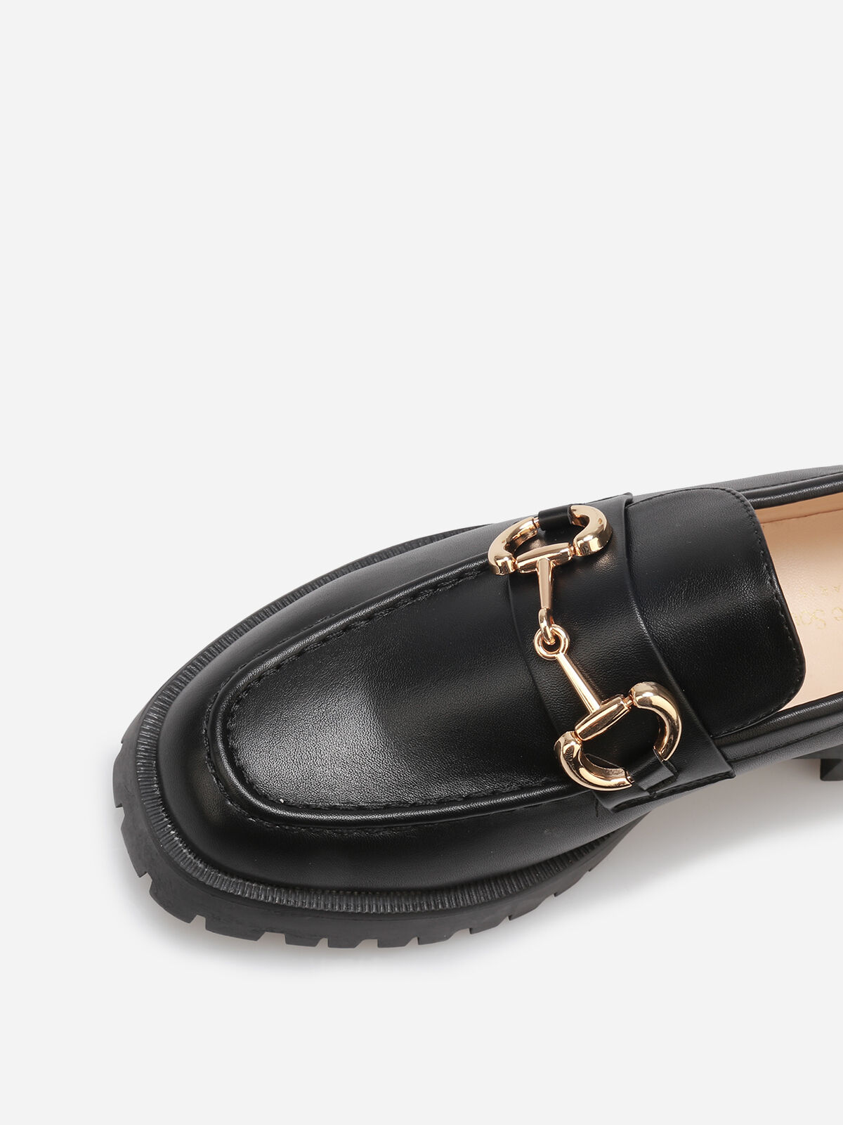 Mocassins à semelle crantée et mors doré- Noir