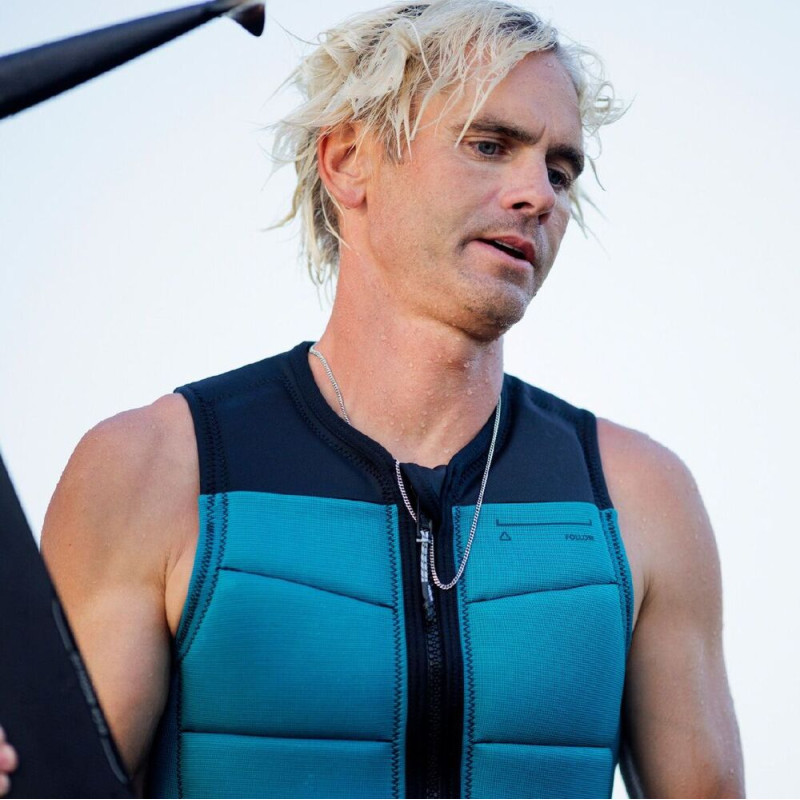Gilet impact follow section black-teal