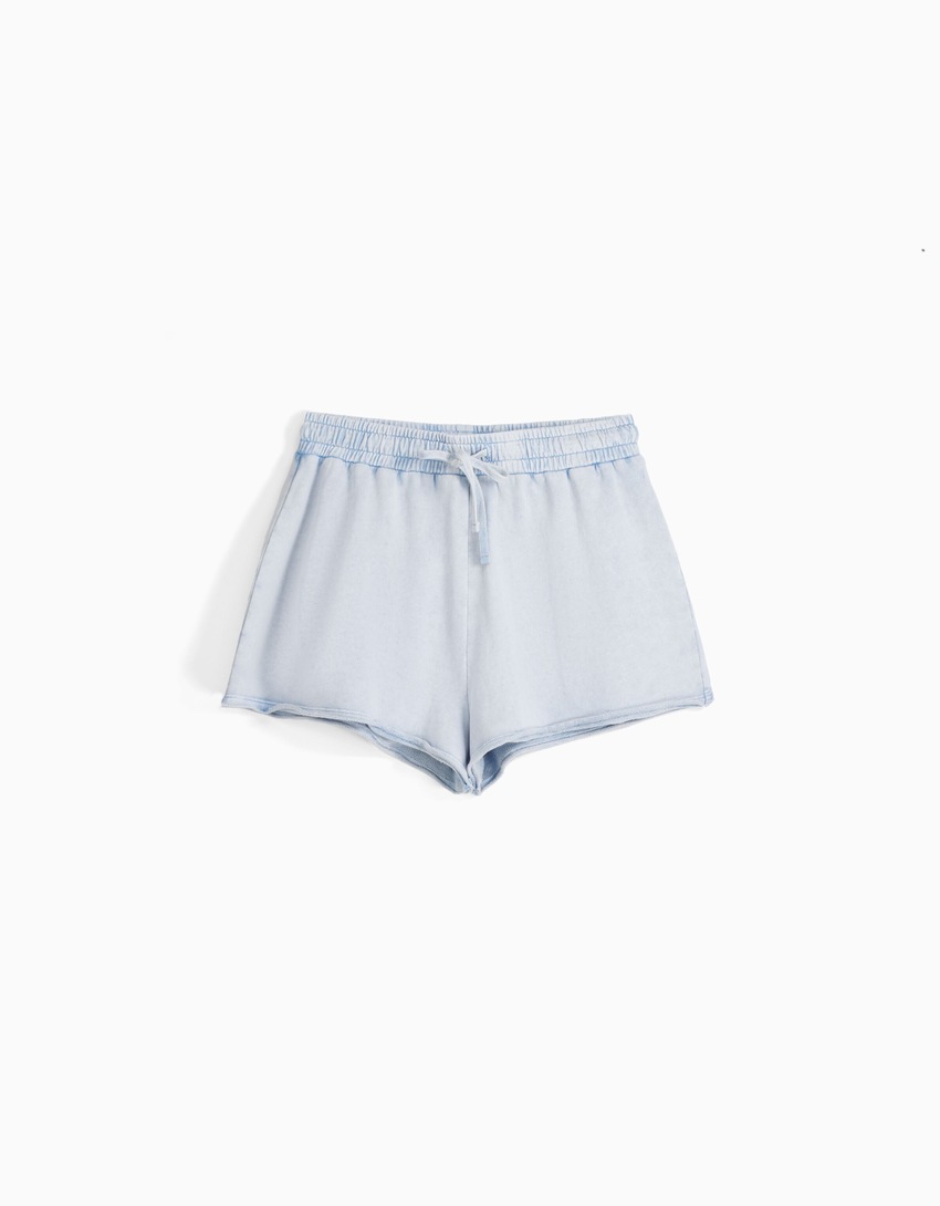 Shorts de pelúcia com efeito desbotado