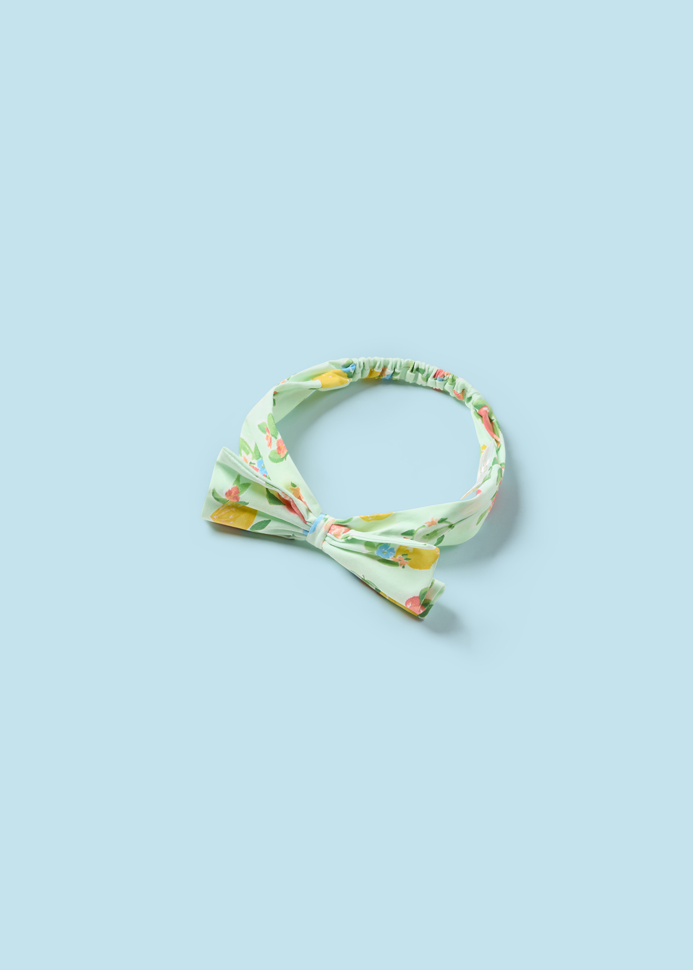 Macacão Better Cotton Juicy para recém-nascido com faixa de cabeça e estampa de frutas.