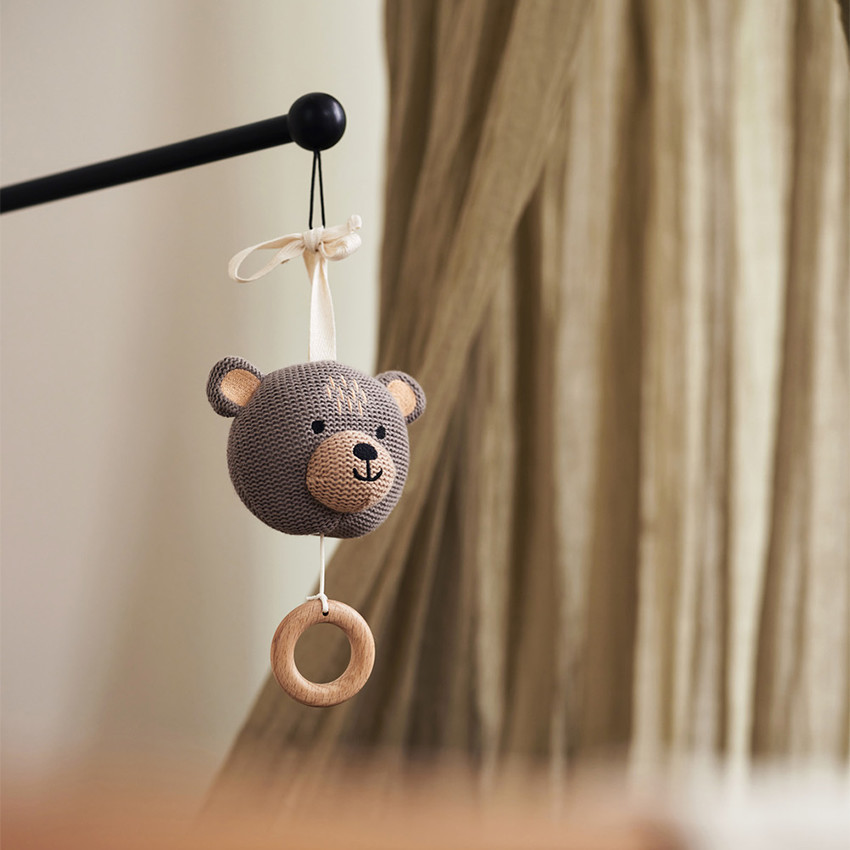 Peluche musicale ourson en tricot