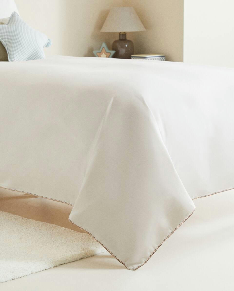 Lençol de baixo com costura decorativa