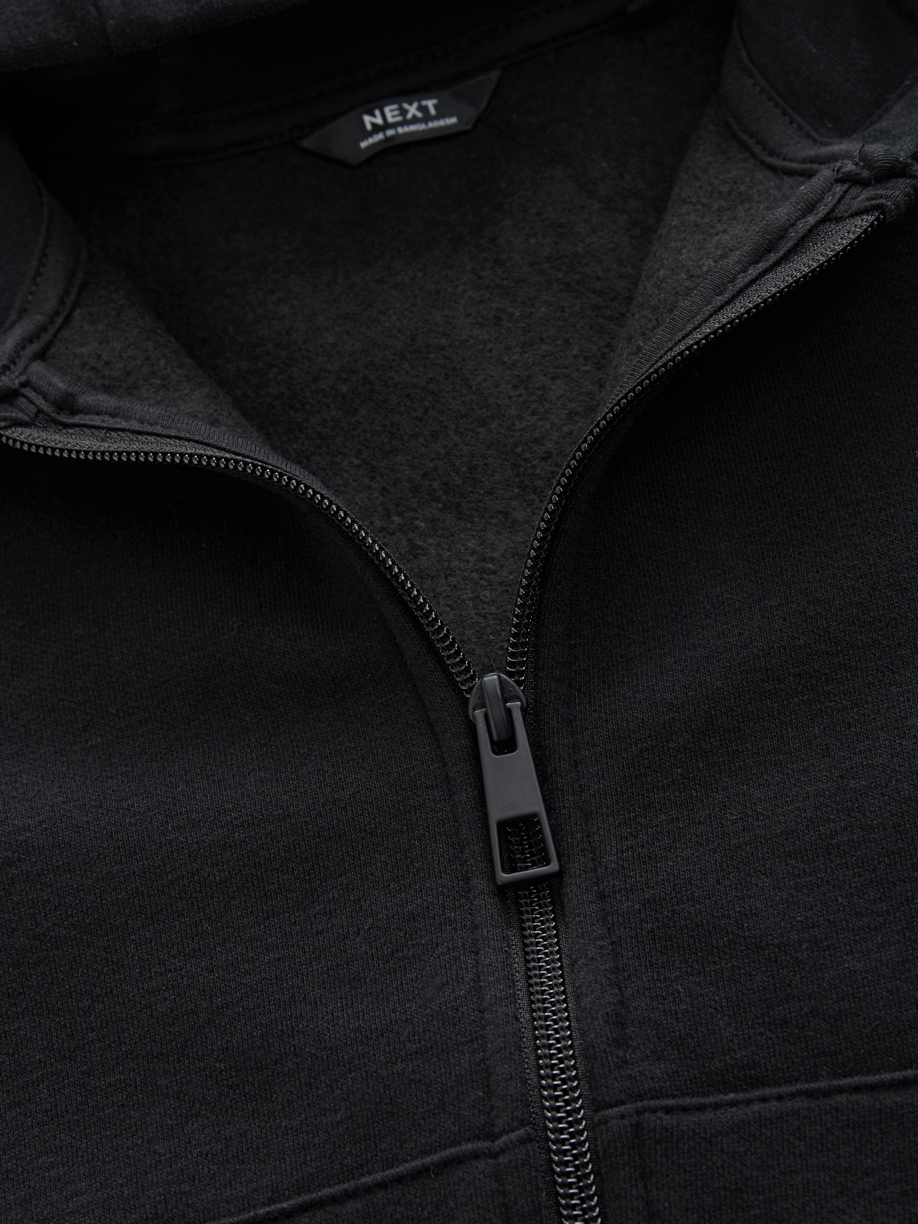 Zwart - Effen hoodie met doorlopende rits (3-16 jr)