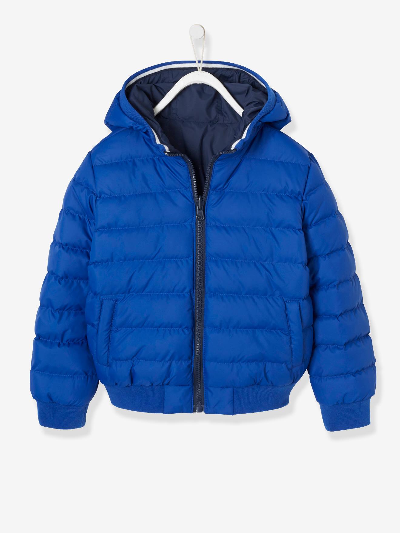 Jaqueta lisa azul-escura reversível para meninos com estampas.