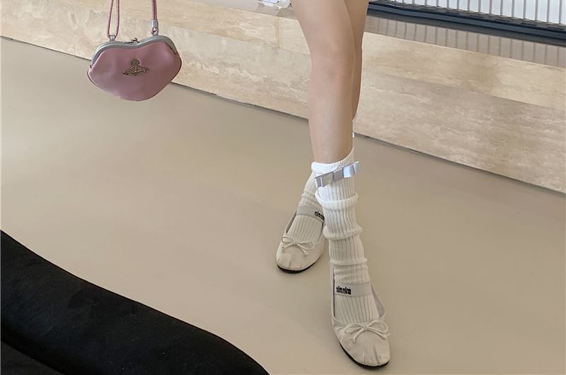 Miss Kekeli - Hoge taille, effen, geplooide mini-A-lijn rok