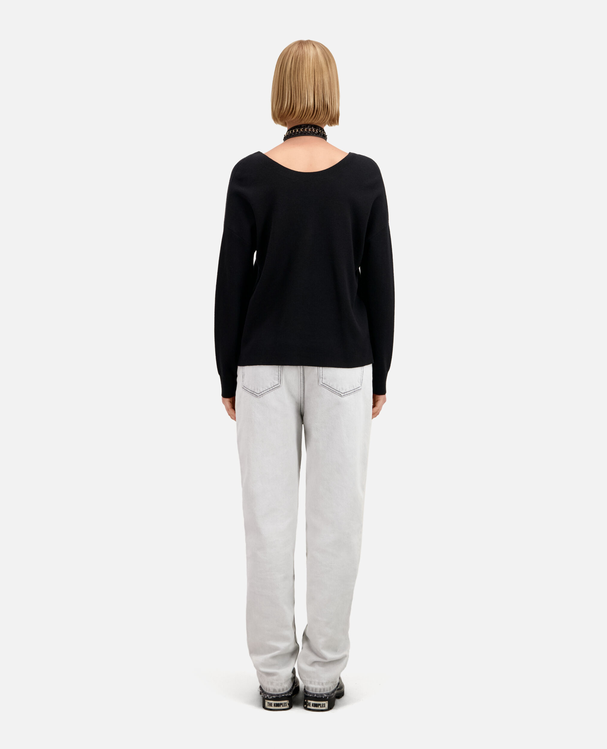 Ecru sweater with buttoning on the back