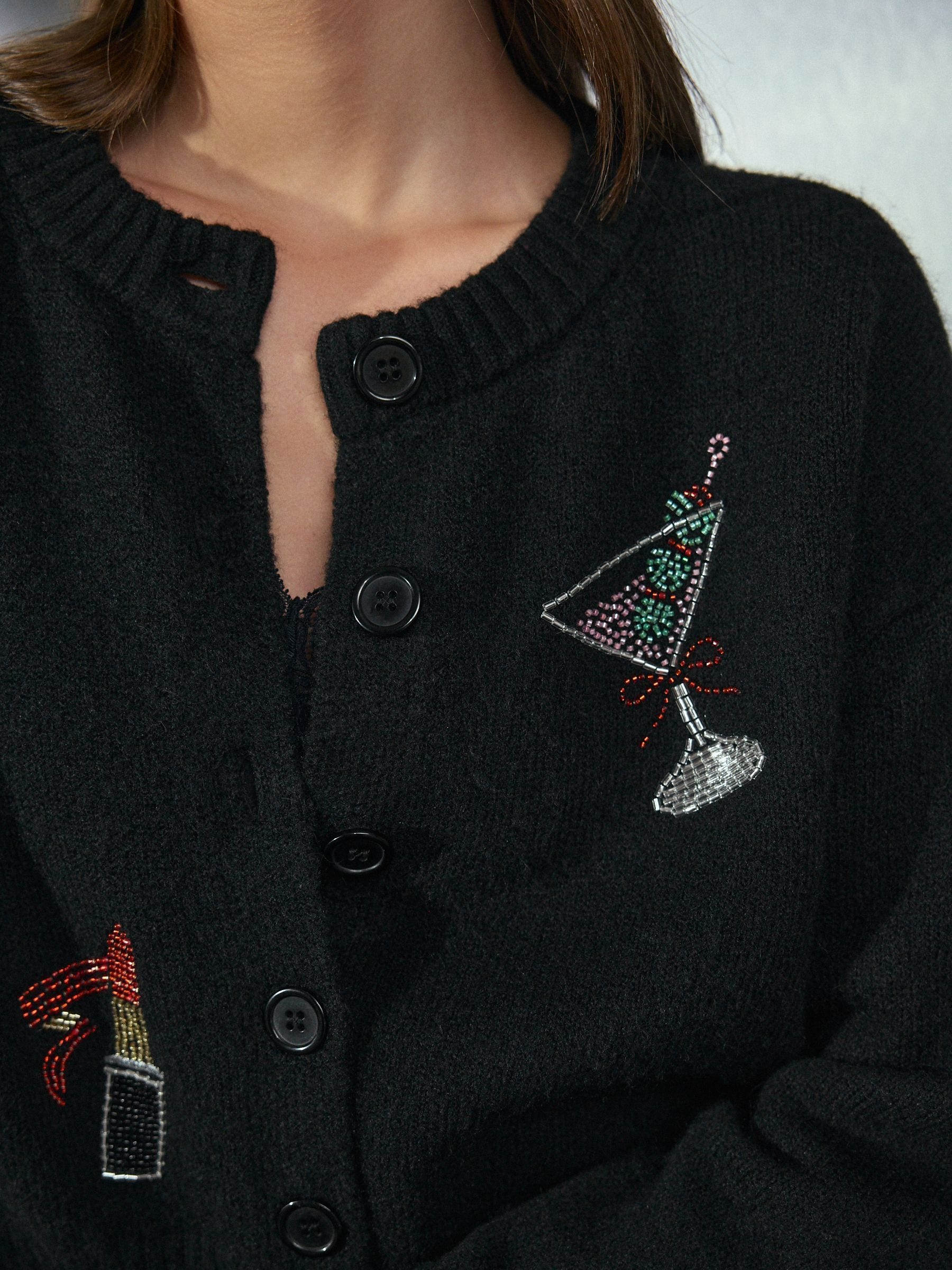 Zwarte geborduurde cocktailjurk - Gebreid vest met ronde hals