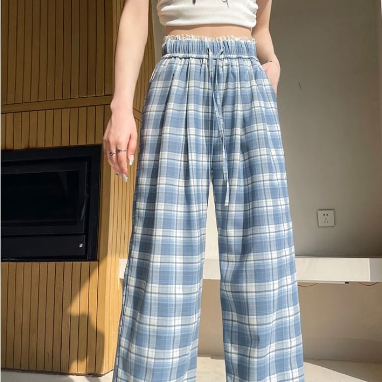 Tel tot 10 - Broek met trekkoord in de taille, geruite kant en wijde pijpen (verschillende ontwerpen)