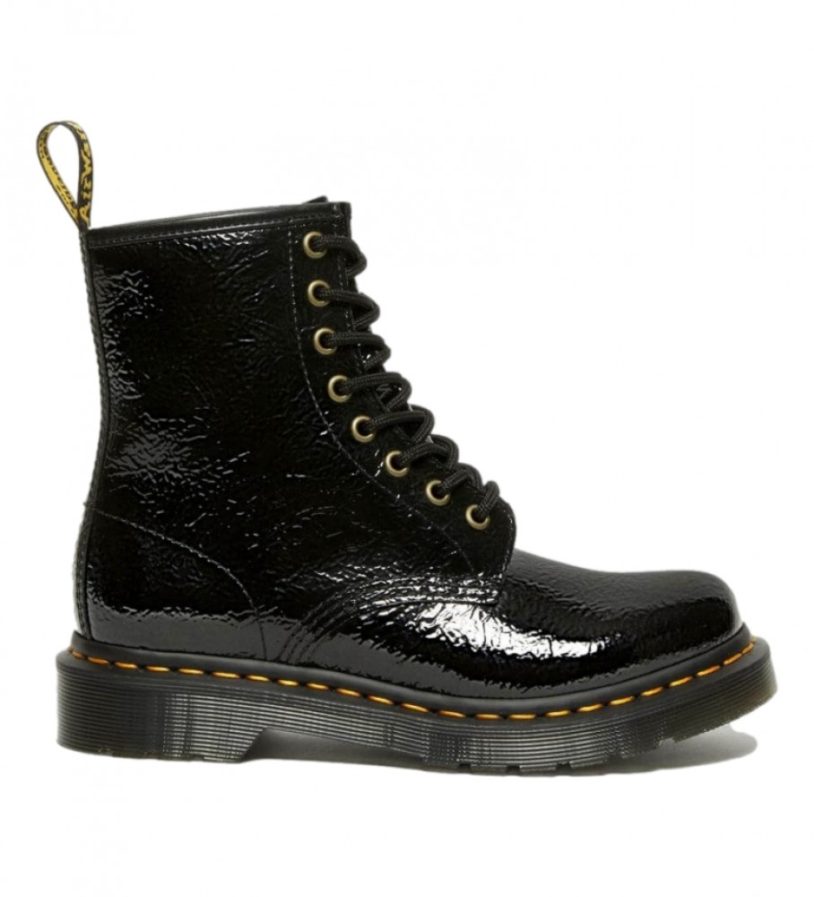 Botas Dr. Martens 1460 em couro envernizado com efeito desgastado, pretas.