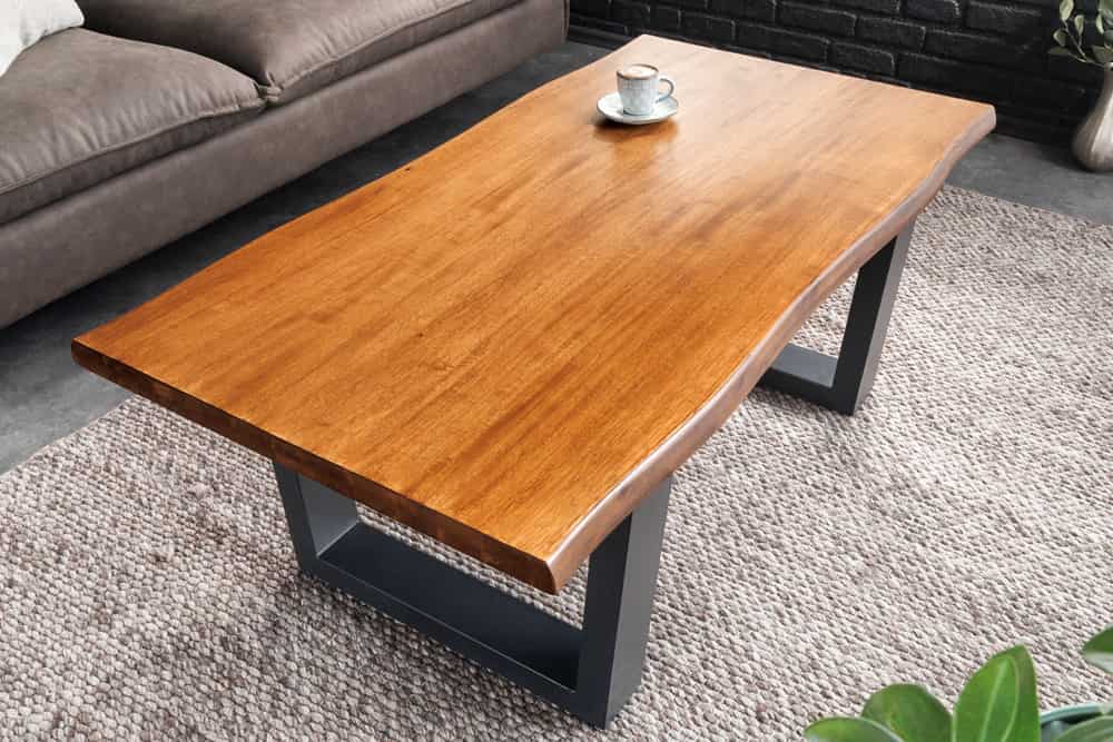 Massiver Couchtisch GENESIS 110cm braun Akazienholz Baumkante V-Gestell