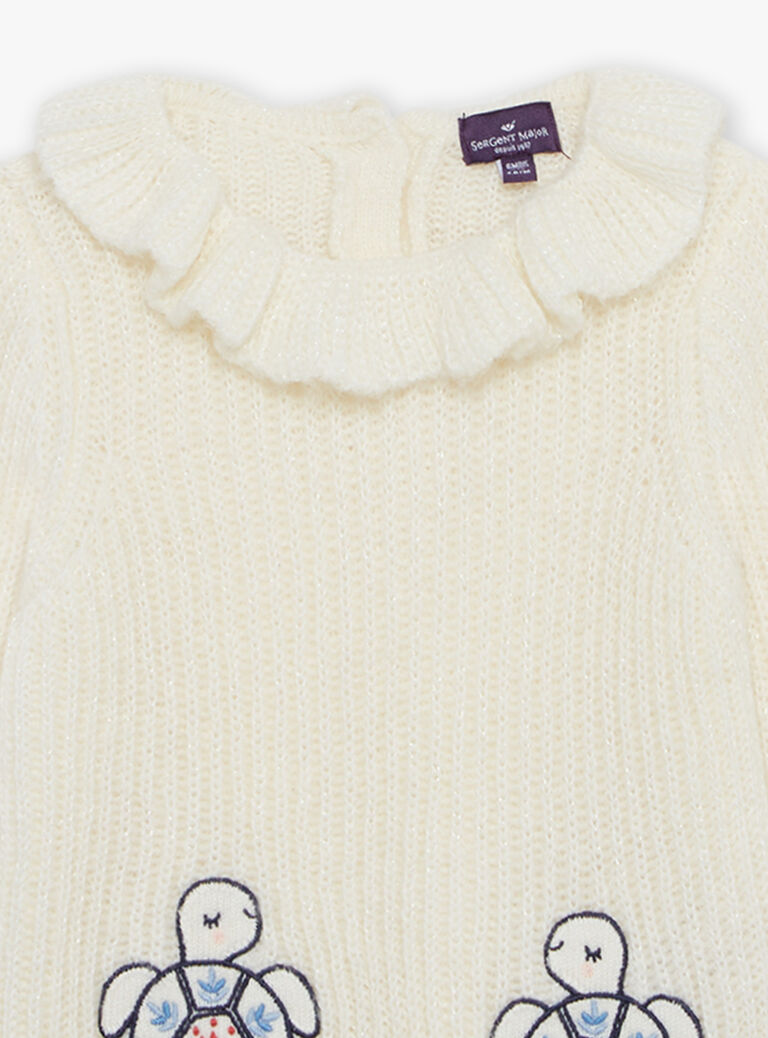 Pull écru en tricot avec tortues