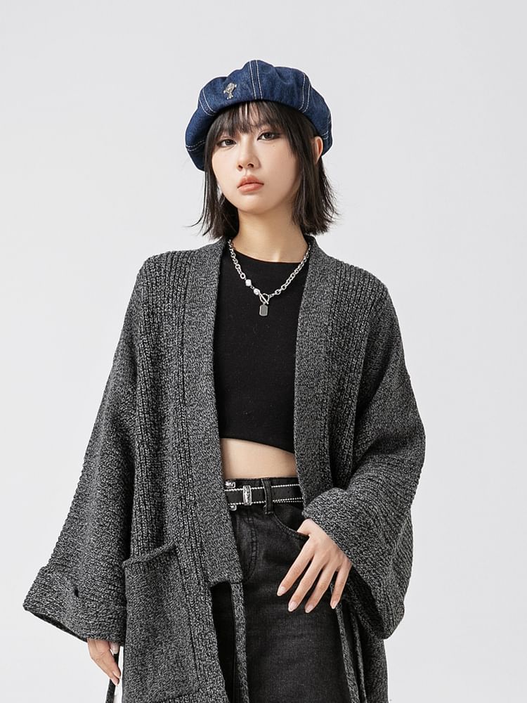 Chuoku - Uitlopende cardigan met vetersluiting, effen mouwen en zakdetail