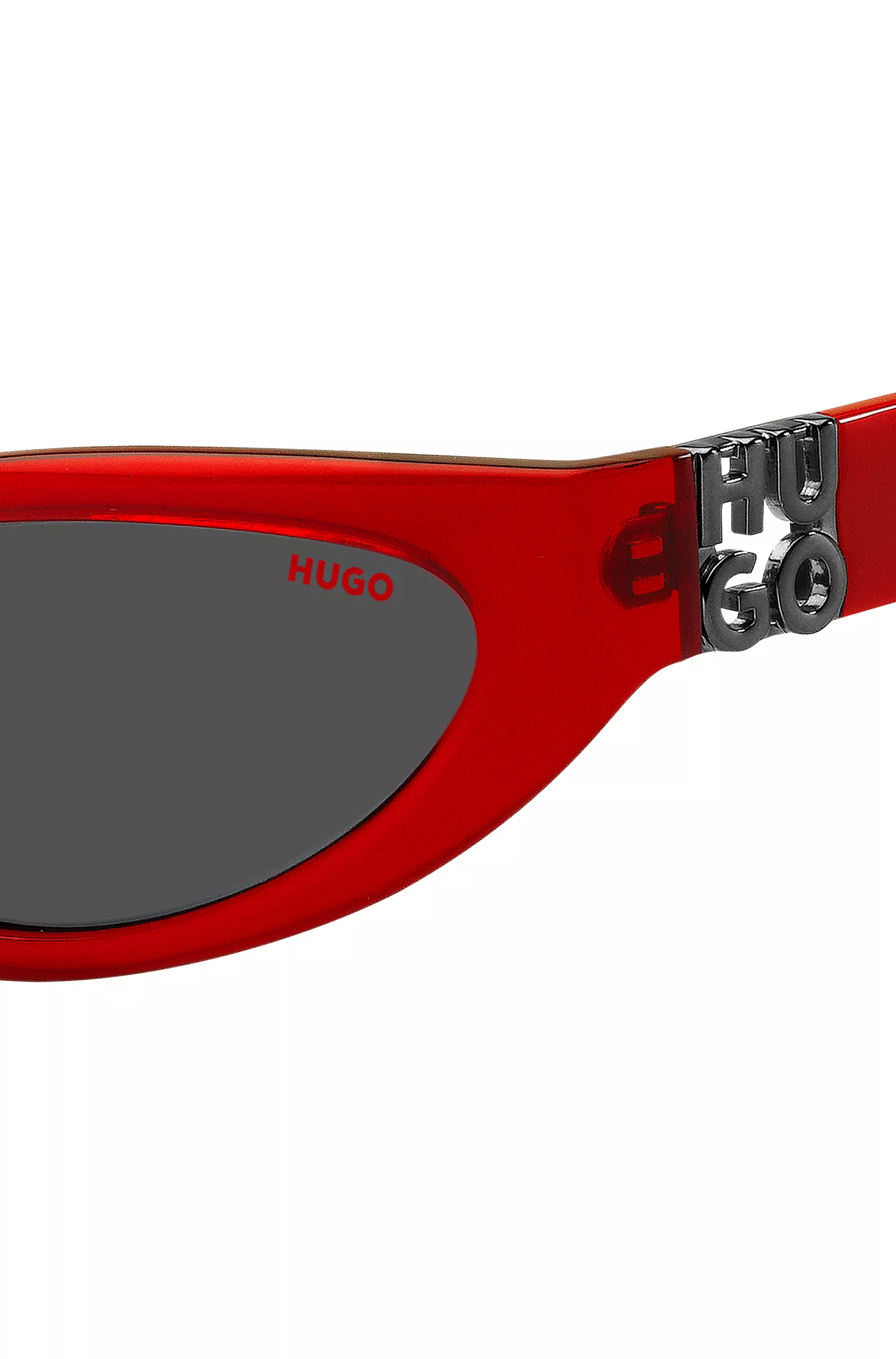 Armação de óculos HUGO em acetato vermelho com monograma 3D.