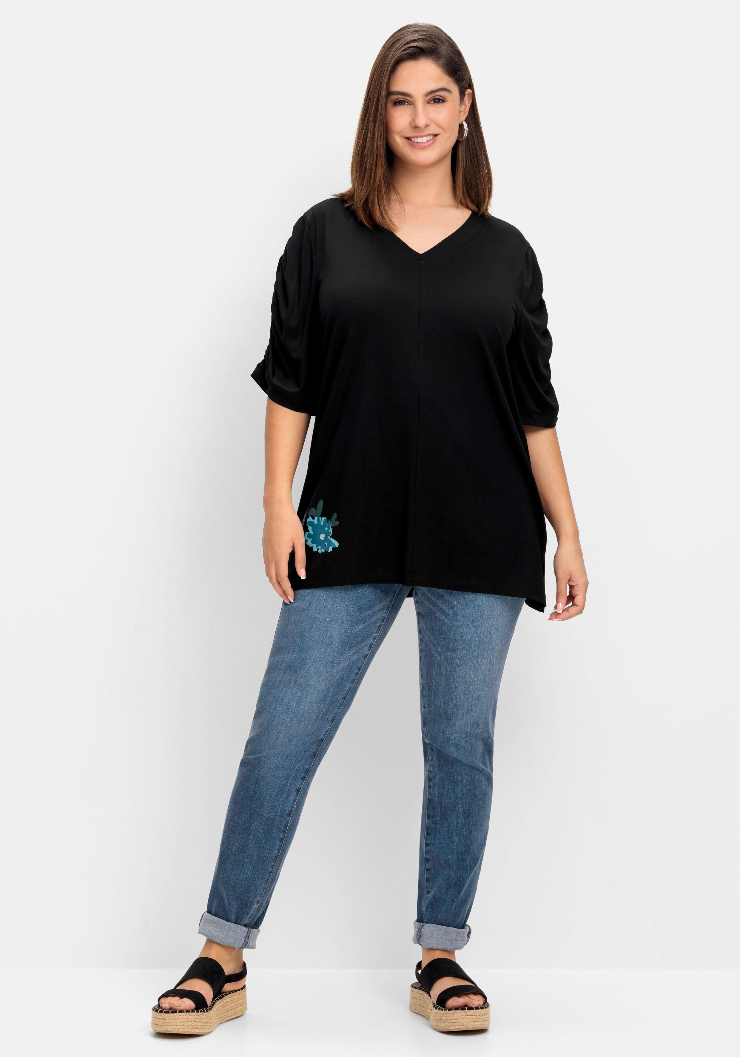 Shirt mit Blütenprint am Saum