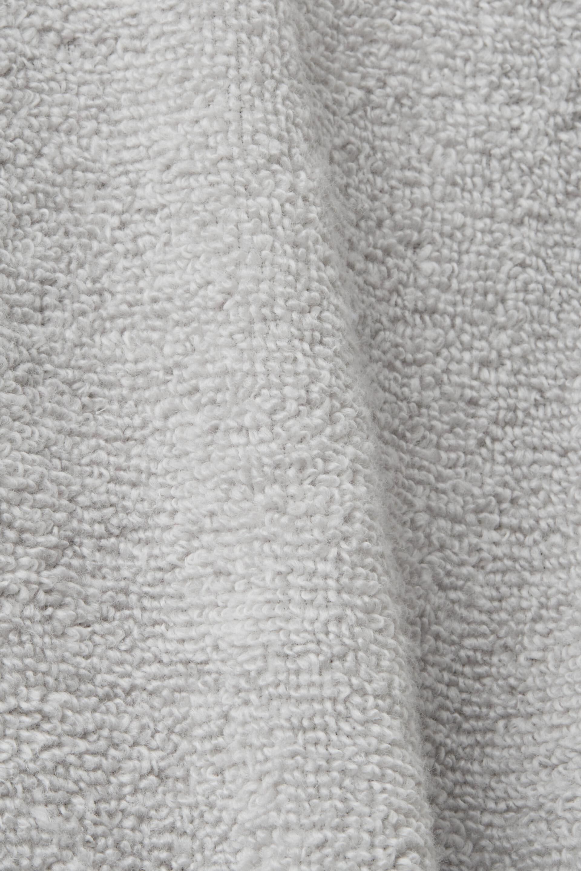 Peignoir en tissu éponge à doublure rayée