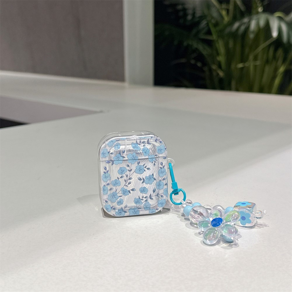 AirPods (1. & 2. Generation) Gummi Case Schutzhülle mit Handschlaufe Blumen Design - Blau / Transparent